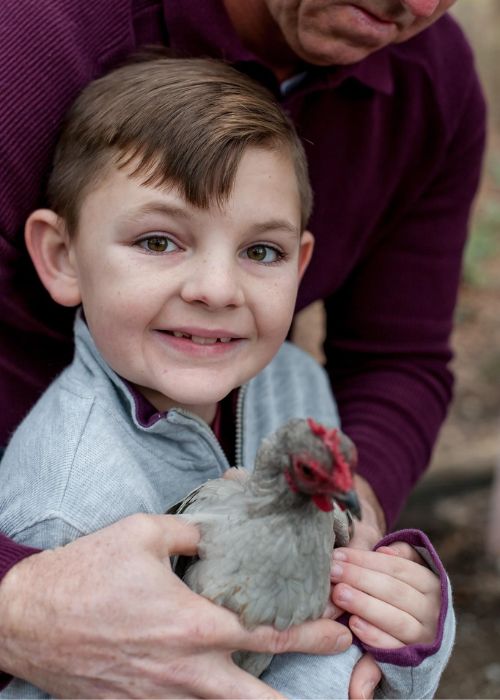 Holding a chicken at Little Creek Farm