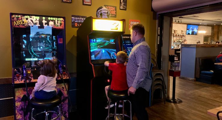 Kids playing arcade games at Chubby's Burgers