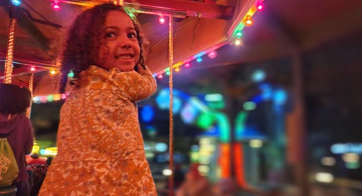 Riding the carousel at Wild Lights, Riverbanks Zoo