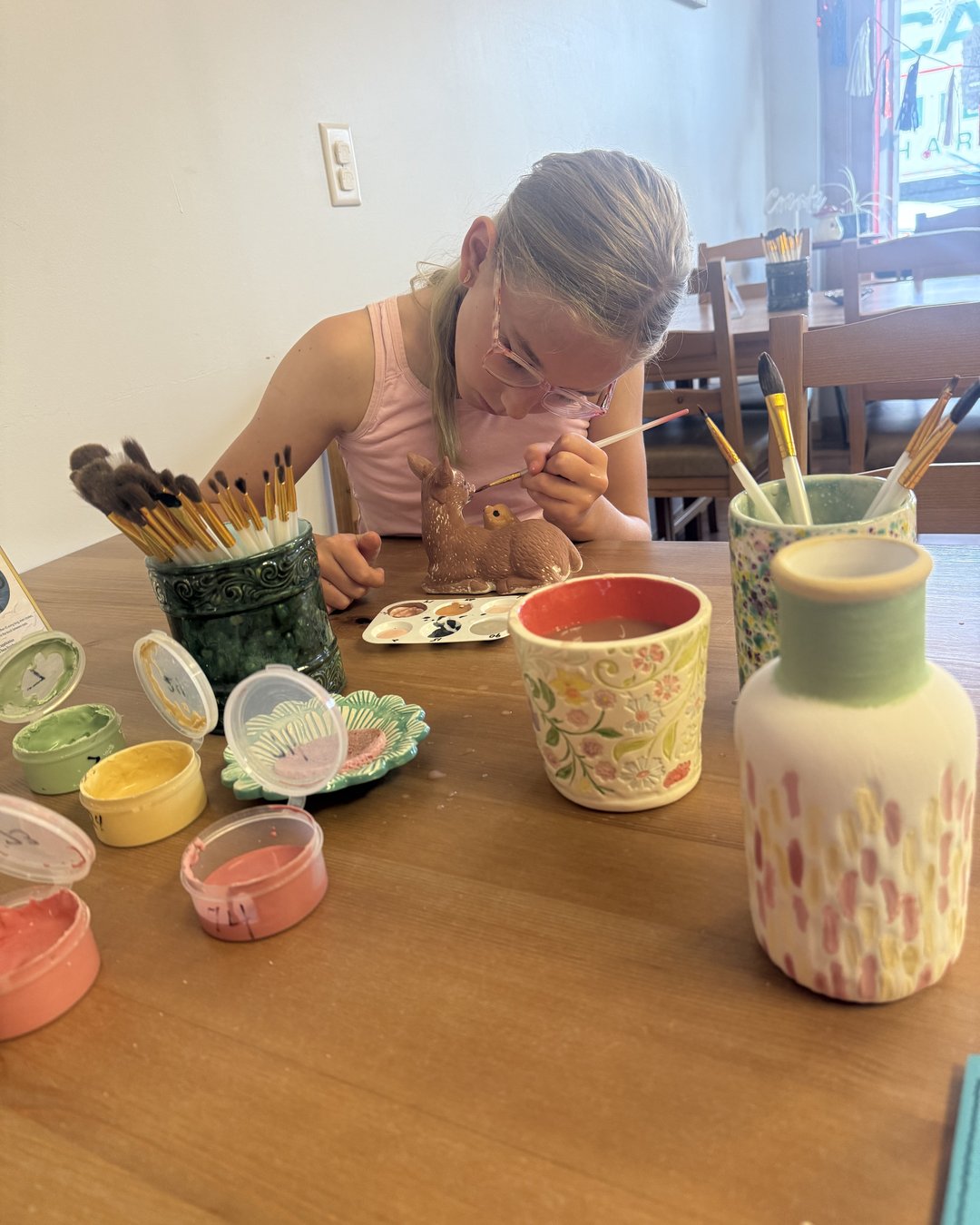 Kids painting pottery at Dodo N Jeans in Camden SC