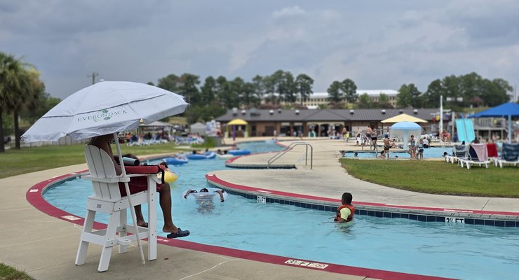 Families tubing through the lazy river at Palmetto Falls Water Park Fort Jackson Columbia SC