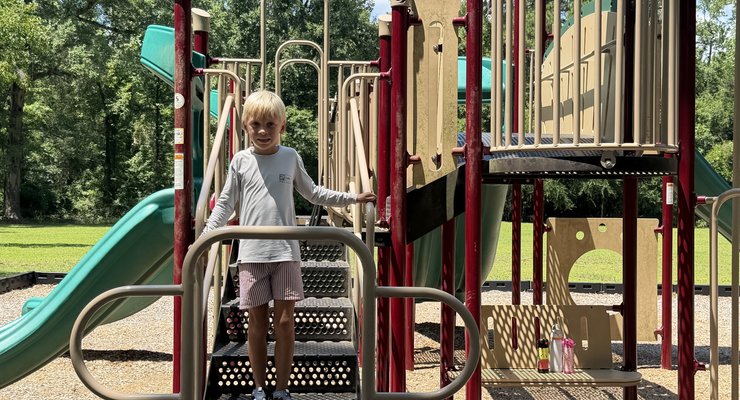 Child playing on the playground at Poinsett State Park Wedgefield SC