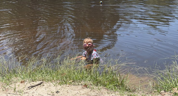 Kids swimming in the lake swimming area at Poinsett State Park during summer
