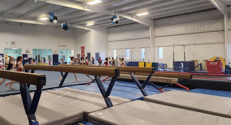 Balance beams and padded mats inside Lake Murray Gymnastics in Irmo, SC