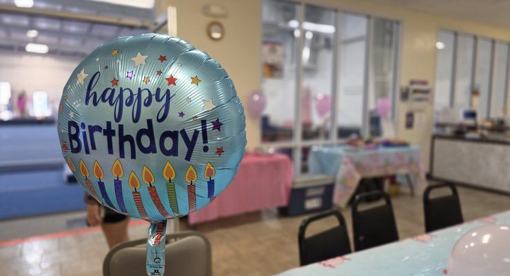 Happy Birthday balloon in the party area at Lake Murray Gymnastics