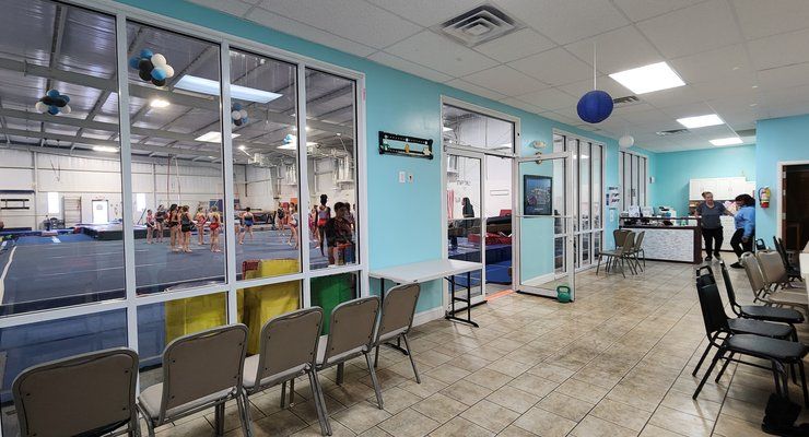 Party room with windows overlooking the gym floor at Lake Murray Gymnastics