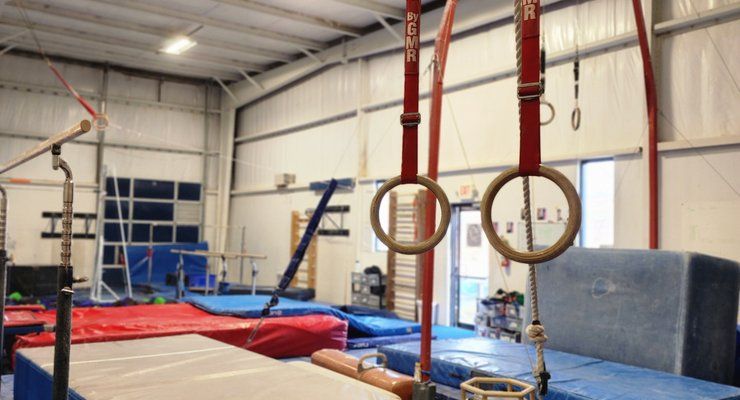 Gymnastic rings, bars, and padded mats at Lake Murray Gymnastics in Irmo, SC