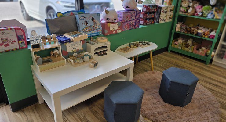 Kids play table with stools and toys at Linga Binga in Chapin, SC